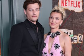 Jake Bongiovi and Millie Bobby Brown attend the Netflix Enola Holmes 2 
