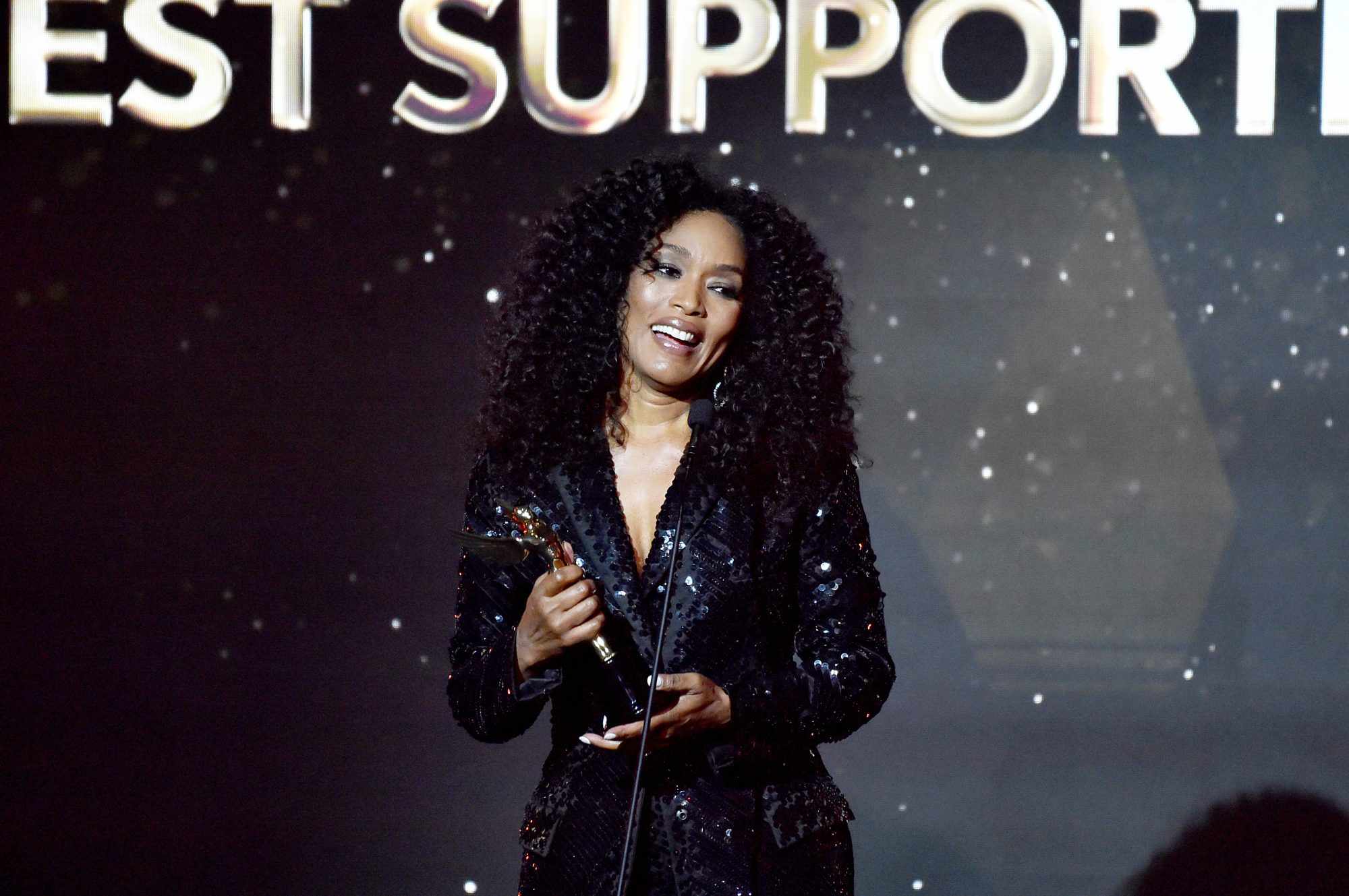 BEVERLY HILLS, CALIFORNIA - FEBRUARY 24: Angela Bassett accepts the Best Supporting Actress award for 'Black Panther: Wakanda Forever' onstage during the Hollywood Critics Association's 2023 HCA Film Awards at Beverly Wilshire, A Four Seasons Hotel on February 24, 2023 in Beverly Hills, California. (Photo by Alberto E. Rodriguez/Getty Images)