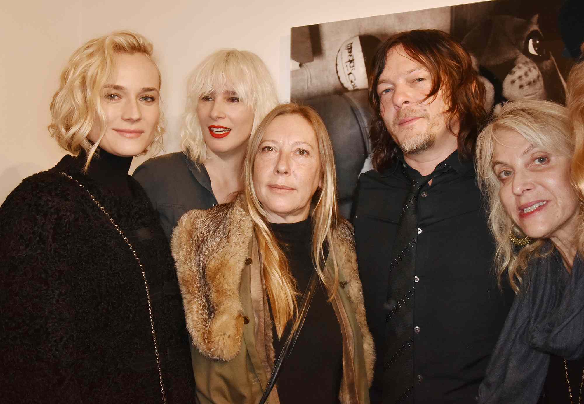 Diane Kruger, a guest, director Fabienne Berthaud, Norman Reedus and curator Laurie Dolphin attend "Norman Reedus" Photo Exhibition around his book "The Sun's Coming Up... Like a Big Bald Head" at Galerie Hors Champs on December 15, 2016 in Paris, France