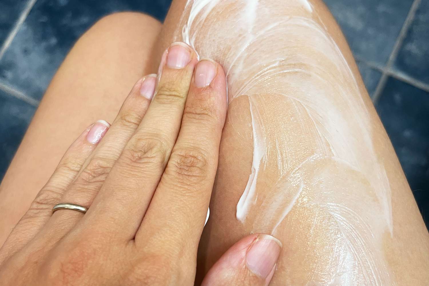 Person applying La Roche-Posay Lipikar Soothing Relief Eczema Cream to their legs