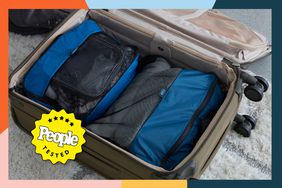 Some of the best packing cubes in a suitcase being tested with a People Tested badge.
