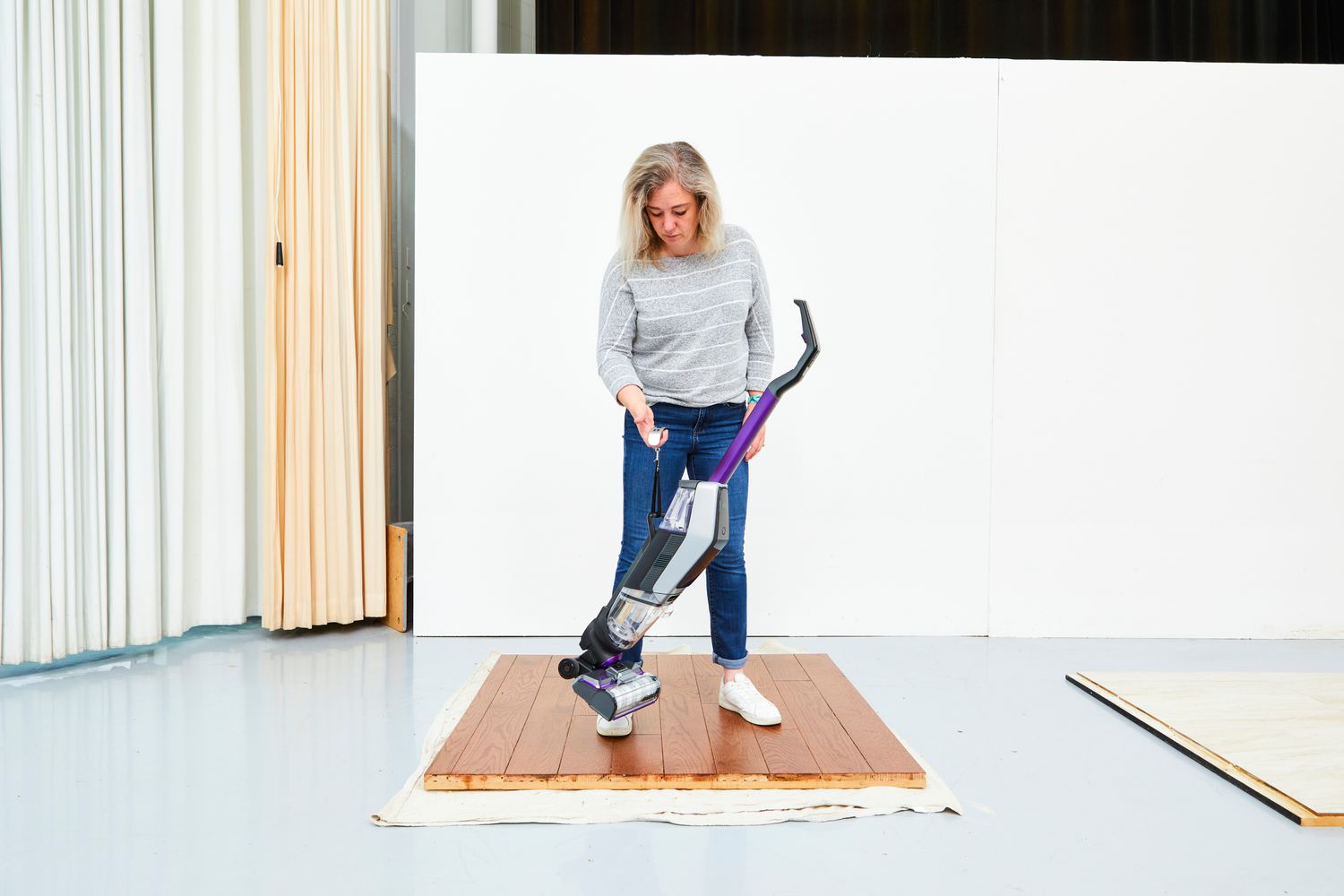 women on wooden floor on vacuum