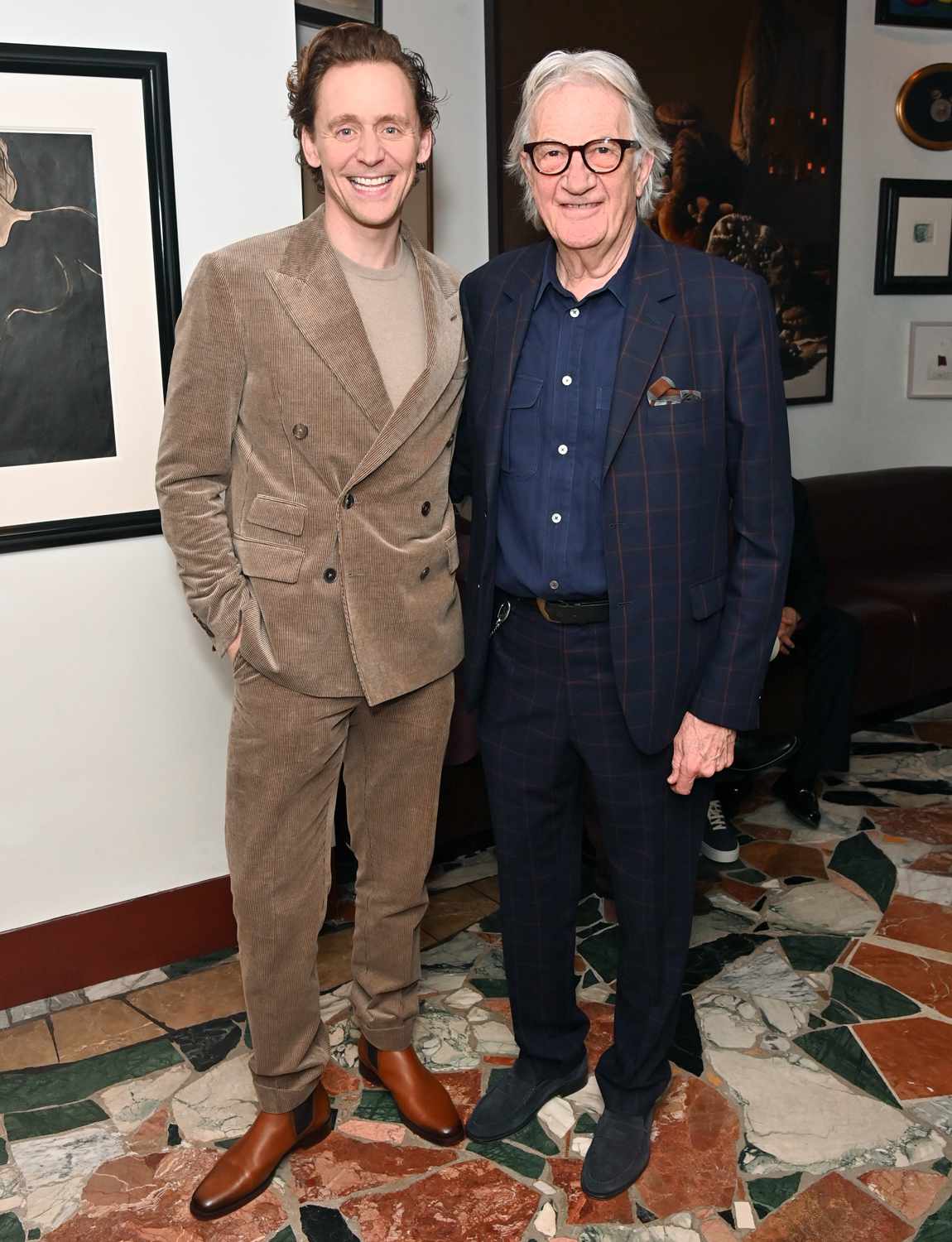 Tom Hiddleston (L) and Sir Paul Smith attend an exclusive dinner hosted by British GQ and Paul Smith to celebrate Excellence in Film with Barry Keoghan at Mount Street Restaurant on February 15, 2024 in London, England.