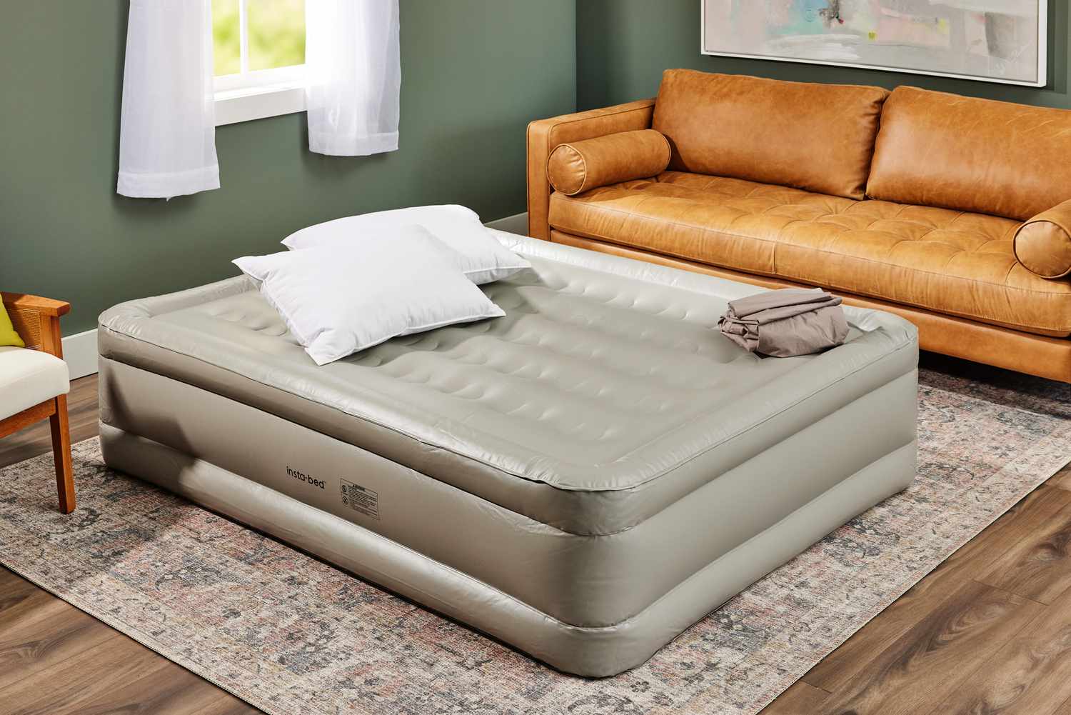 The Insta-Bed Raised 18-in Queen Pillow Top Air Mattress & Internal Never Flat Pump fully inflated