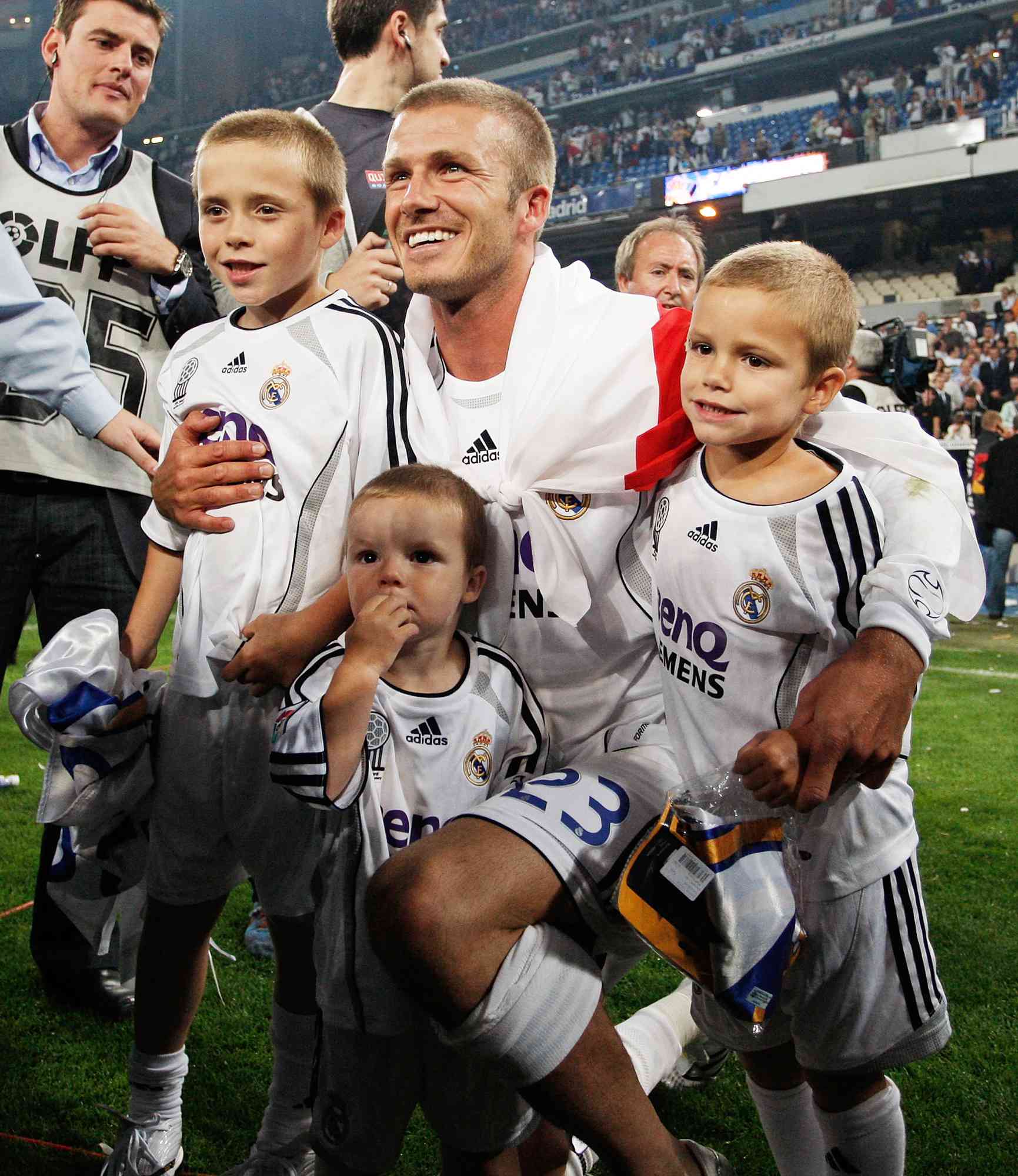 David Beckham of Real Madrid celebrates with his children Brooklyn, Cruz and Romeo after Real won the Primera Liga title after the match between Real Madrid and Mallorca at the Santiago Bernabeu stadium on June 17, 2007 in Madrid, Spain