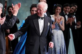 Britain's King Charles III reacts as he meets with the cast of a special Gala performance, on the day of an event celebrating Antonio Pappano's 22 years as Music Director at the Royal Opera House on May 16, 2024 in London, England.