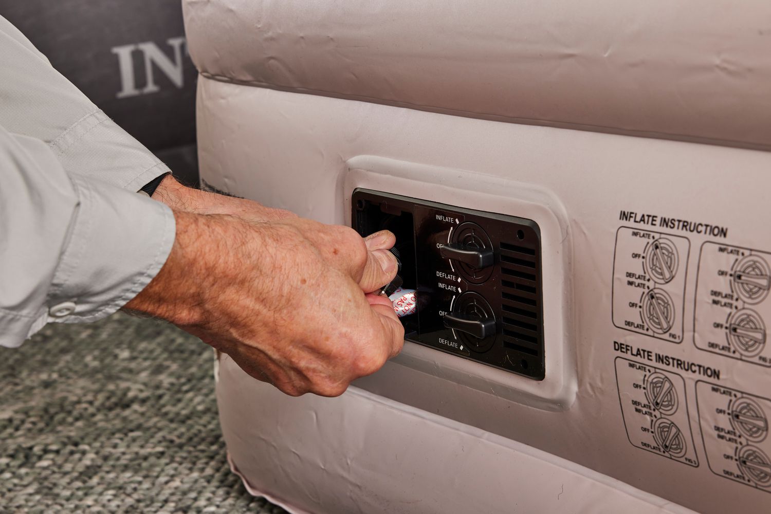A person plugs in the Chillsun Twin Air Mattress