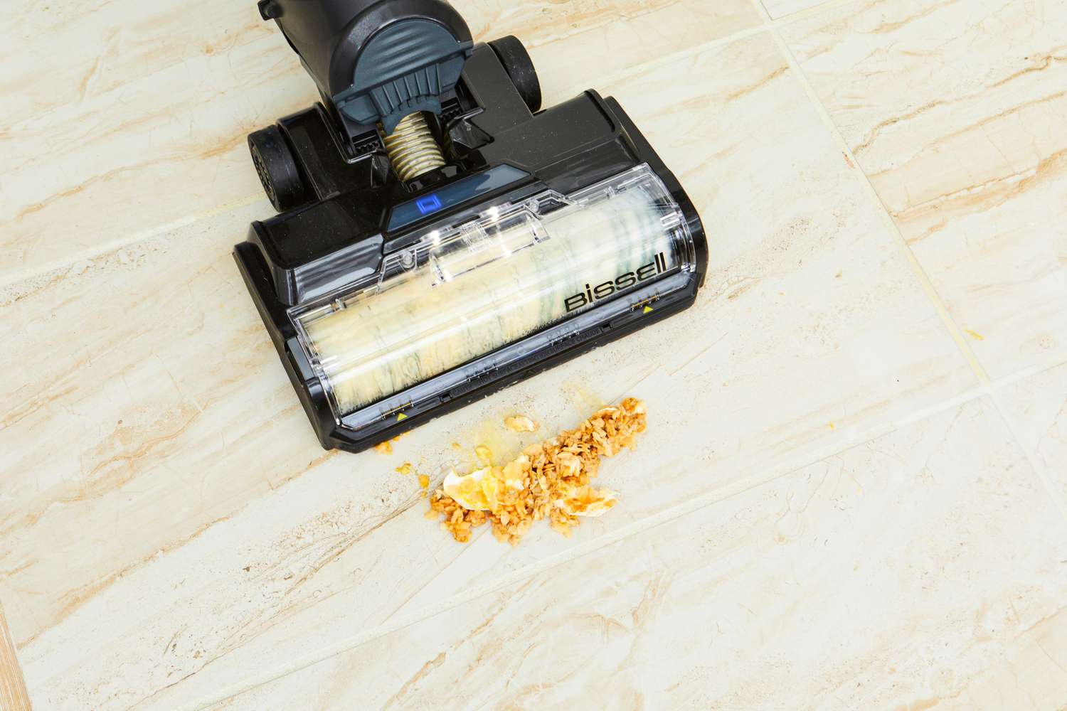 Bissell CrossWave HydroSteam Plus Multi-Surface Wet Dry Vac cleaning cereal and egg from a wood floor