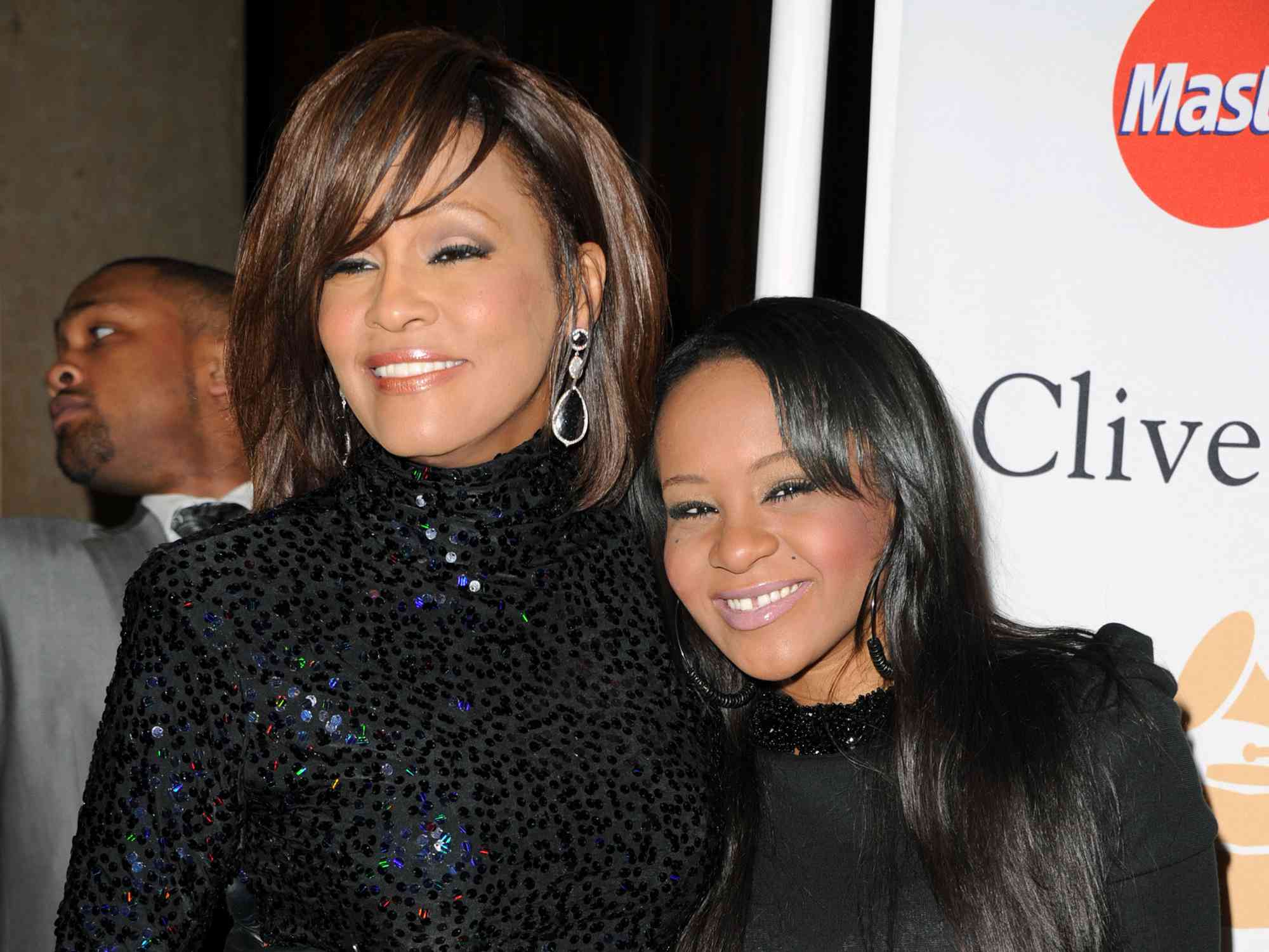Whitney Houston (L) and Bobbi Kristina Brown arrives at the 2011 Pre-GRAMMY Gala and Salute To Industry Icons Honoring David Geffen at Beverly Hilton on February 12, 2011 in Beverly Hills, California