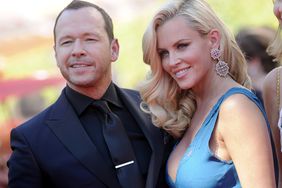 Jenny McCarthy and Donnie Wahlberg arrive at the 2014 Creative Arts Emmy Awards at Nokia Theatre L.A. Live on August 16, 2014 in Los Angeles, California