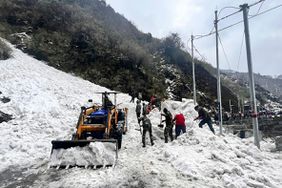 In this handout photo released by the Indian Army, soldiers clear snow from an avalanche near Nathu La mountain pass in India's Sikkim state, Tuesday, April, 4, 2023. An avalanche swept away a group of tourists in the Himalayas in northeastern India on Tuesday, killing at least six and injuring 11 others, officials and news reports said.