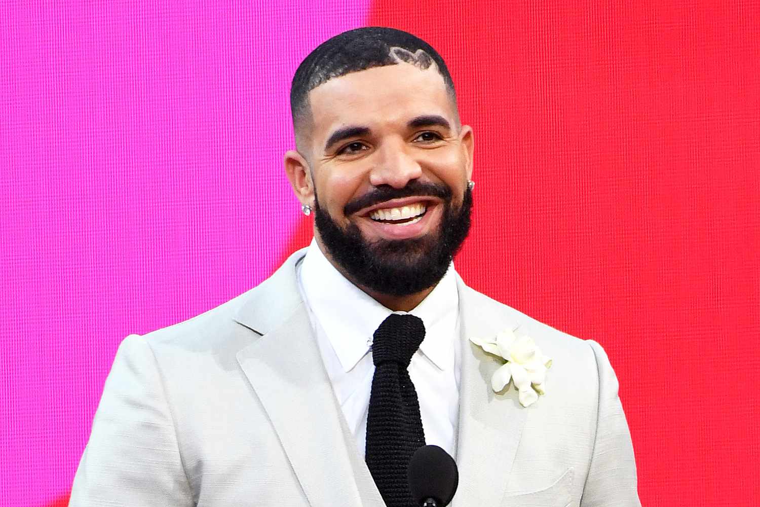 Drake, winner of the Artist of the Decade Award, and Adonis Graham speak onstage for the 2021 Billboard Music Awards, broadcast on May 23, 2021 at Microsoft Theater in Los Angeles, California.