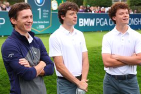 Tom Holland, Sam Holland and Harry Holland interact on the 1st tee during the Pro-Am prior to the BMW PGA Championship at Wentworth Golf Club on September 13, 2023 in Virginia Water, England.