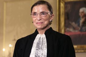 Ruth Bader Ginsburg watches President George W. Bush speak at the swearing-in ceremony on January 28, 2005.