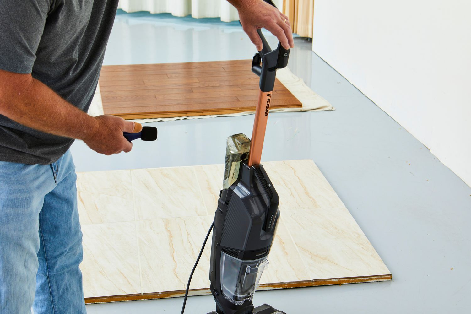Person taking a decibel reading from the Bissell CrossWave HydroSteam Plus Multi-Surface Wet Dry Vac