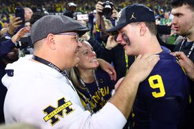 J.J. McCarthy celebrates with his family after 2024 CFP National Championship on January 08, 2024 in Houston, Texas.