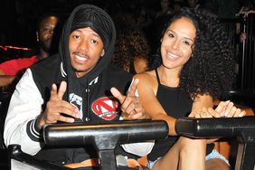 Nick Cannon and Brittany Bell ride the 'Ghostrider' Roller Coaster at Knott's Berry Farm on September 1, 2017 in Buena Park, California