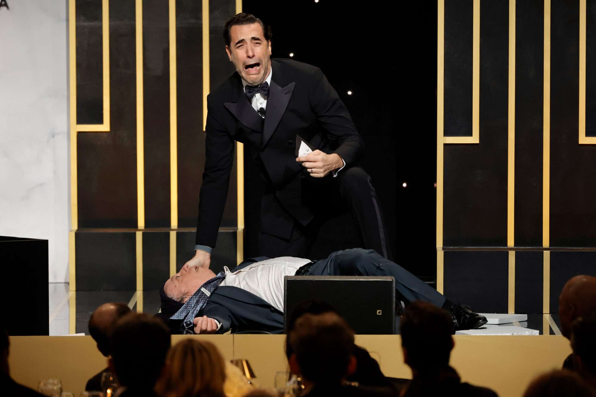 BEVERLY HILLS, CALIFORNIA - FEBRUARY 25: Sacha Baron Cohen acts out a skit onstage during the 2023 Producers Guild Awards at The Beverly Hilton on February 25, 2023 in Beverly Hills, California. (Photo by Kevin Winter/GA/The Hollywood Reporter via Getty Images)