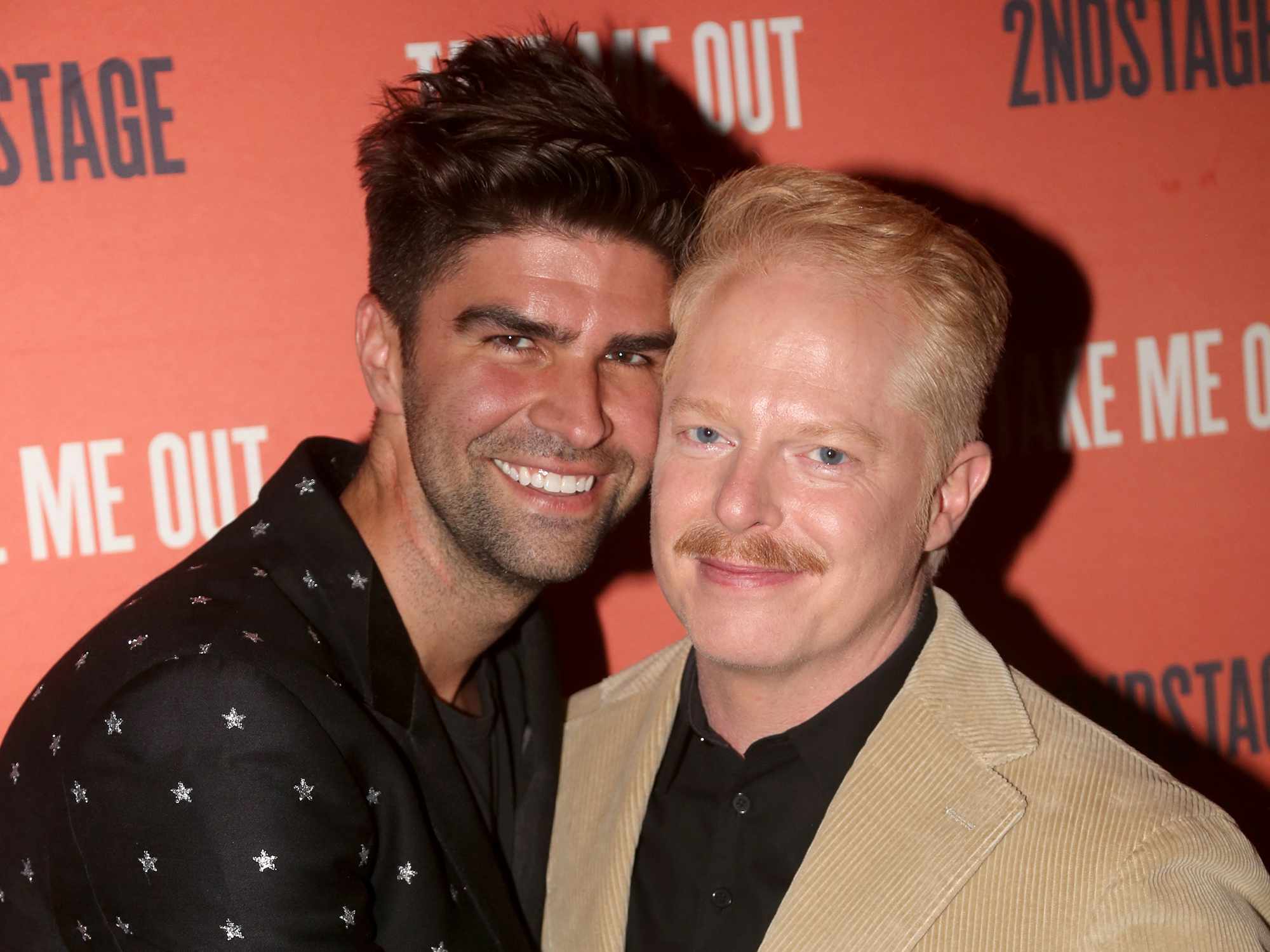 Justin Mikita and Jesse Tyler Ferguson pose at the opening night party for Second Stage Theater's production of "Take Me Out" on Broadway at The Yard House on April 4, 2022 in New York City