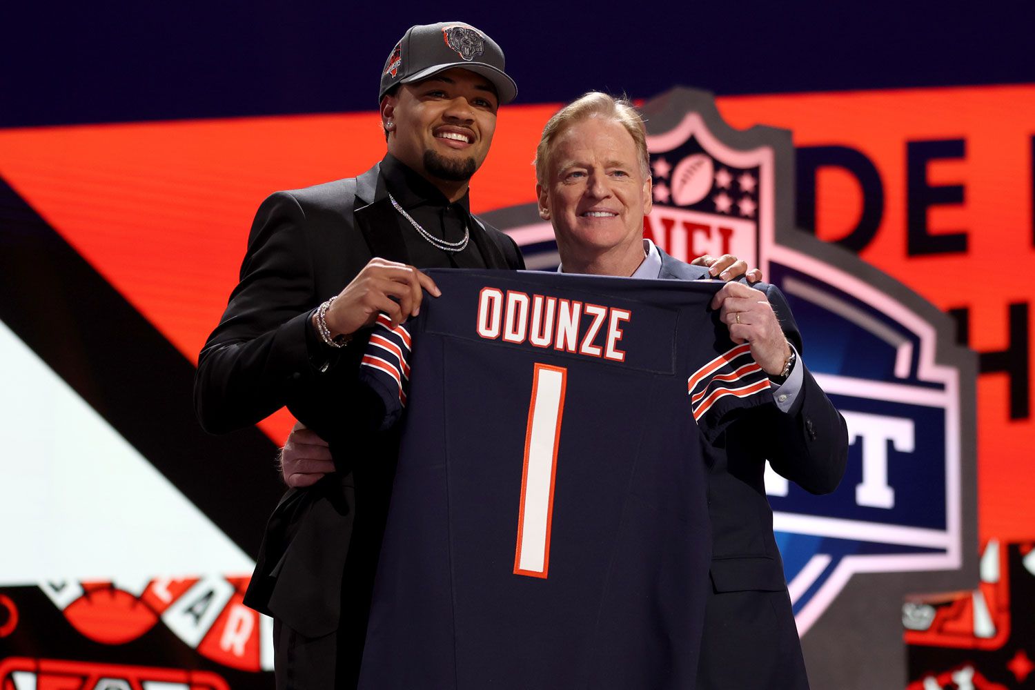 Rome Odunze poses with NFL Commissioner Roger Goodell after being selected ninth overall by the Chicago Bears during the first round of the 2024
