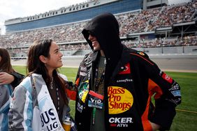 DAYTONA BEACH, FLORIDA - FEBRUARY 19: Pete Davidson and Chase Sui wait on the grid prior to the NASCAR Cup Series 65th Annual Daytona 500 at Daytona International Speedway on February 19, 2023 in Daytona Beach, Florida. (Photo by Chris Graythen/Getty Images)