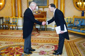 Britain's King Charles III (L) greets The Ambassador of Moldova, Ruslan Bolbocean during a private audience at Buckingham Palace in London on March 28, 2024