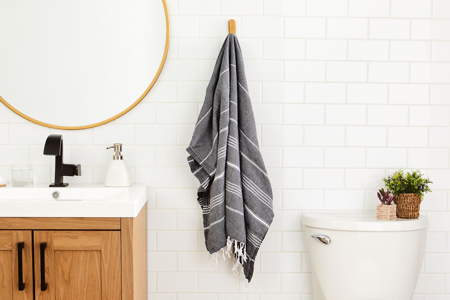 Cacala 100% Organic Cotton Pestemal Turkish Bath Towel hung on hook in bathroom