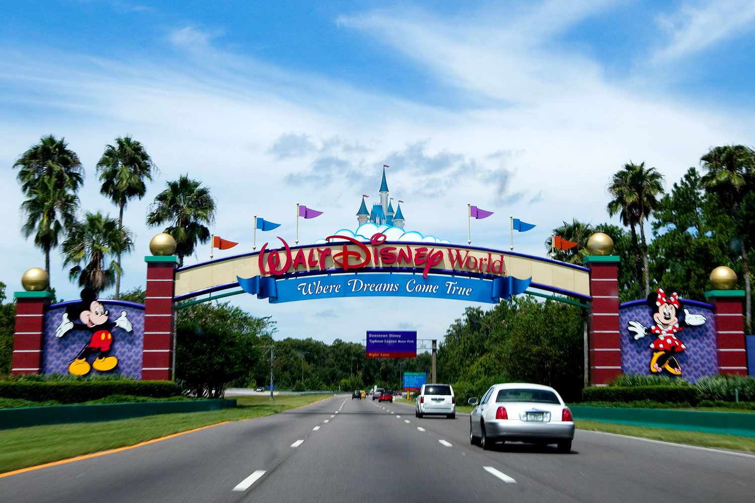 Vehicles pass the entrance to the Walt Disney World theme park and resort in Lake Buena Vista, Florida, U.S., on Monday, Aug. 31, 2009. Walt Disney Co. said it agreed to buy Marvel Entertainment Inc. for about $4 billion in a stock and cash transaction, gaining comic book characters including Iron Man, Spider-Man and Captain America.
