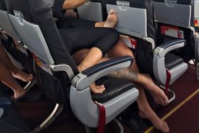 Plane passengers cuddle barefoot