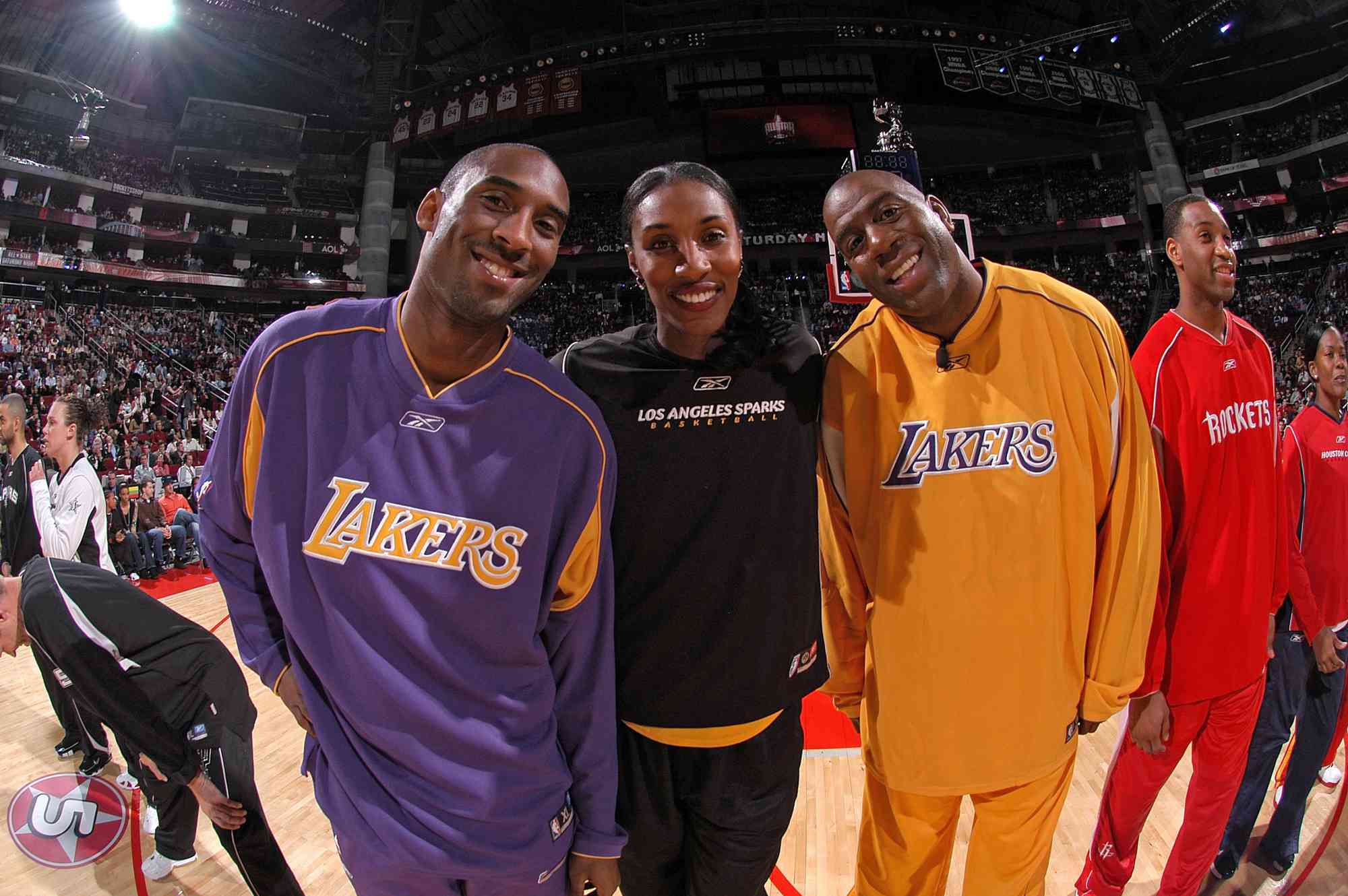 Kobe Bryant #8 of the Los Angeles Lakers, Lisa Leslie #9 of the Los Angeles Sparks and former Los Angeles Lakers guard Earvin "Magic" Johnson pose for a photo during the Radio Schack Shooting Stars competition on All-Start Saturday Night during 2006 All-Star Weekend February 18, 2006 