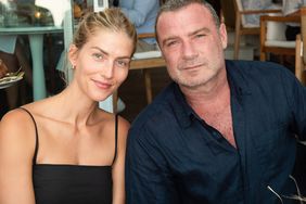 Taylor Neisen and Liev Schreiber attend the Hamptons Magazine Fall Fashion event with Zadig and Voltaire at Si Si Restaurant on August 28, 2022 in East Hampton, New York