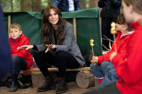 Prince William, Prince of Wales and Britain's Catherine, Princess of Wales react during a visit to Madley Primary School's 'Forest School' in Hereford