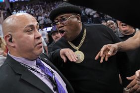 Earl Tywone Stevens Sr., known as the rapper E-40, yells at arena security personnel before being escorted from courtside seating during Game One of the Western Conference First Round Playoffs between the Golden State Warriors and Sacramento Kings at the Golden 1 Center on April 15, 2023 in Sacramento, California.