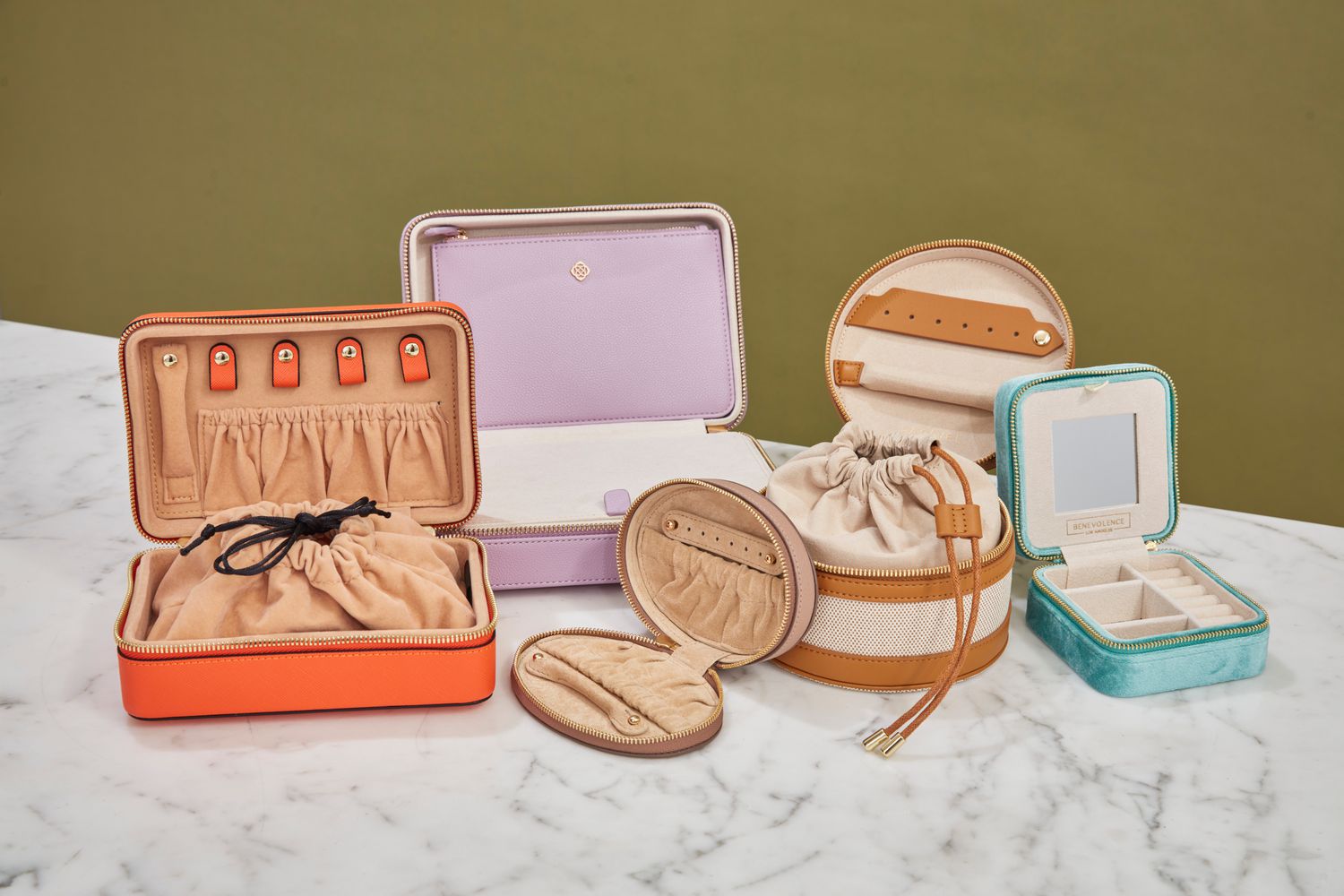 Five of the best travel jewelry cases on a marble table