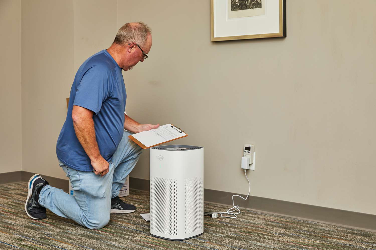  A person tests the Clorox Large Room True HEPA Air Purifier.