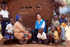 UNHCR Goodwill Ambassador Gugu Mbatha-Raw visits the home of Vicky and her family, who live in a resettlement site in Kalehe and have just received a distribution of NFIs (non-food items) from UNHCR.