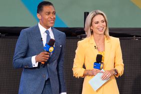 NEW YORK, NEW YORK - JULY 08: (L-R) T.J. Holmes and Amy Robach attend ABC's "Good Morning America" at SummerStage at Rumsey Playfield, Central Park on July 08, 2022 in New York City. (Photo by Noam Galai/Getty Images)