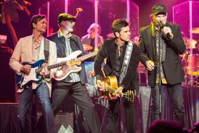 TEMECULA, CA - DECEMBER 31: (L-R) Musicians Scott Totten, Randell Kirsch, John Stamos and Mike Love of The Beach Boys perform on stage at Pechanga Casino on December 31, 2014 in Temecula, California. (Photo by Daniel Knighton/FilmMagic)