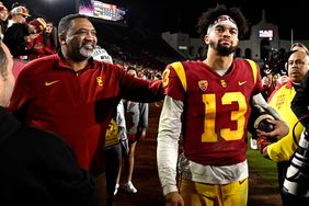 Caleb Williams with his father celebrates USC Trojans defeated the Notre Dame Fighting Irish during a NCAA football game on November 26, 2022.