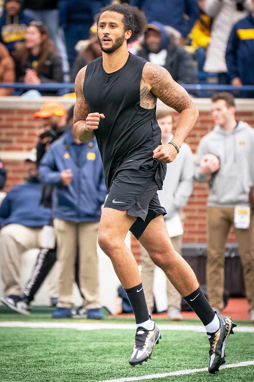 Colin Kaepernick participates in a throwing exhibition during half time of the Michigan spring football game at Michigan Stadium on April 2, 2022 in Ann Arbor, Michigan.