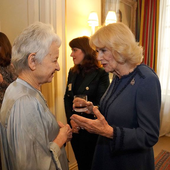 Britain's Camilla, Queen Consort (R) meets children's author Jacqueline Wilson as she hosts a reception at Clarence House in London on February 23, 2023, for authors, members of the literary community and representatives of literacy charities, to celebrate the second anniversary of The Reading Room.