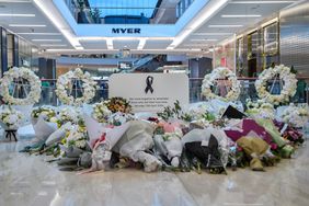 Flowers are displayed at a memorial set up inside the Bondi Junction Westfield Shopping Centre to honour the victims of a stabbing attack at the mall in Sydney on April 19, 2024.