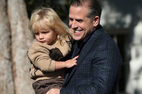 Hunter Biden, the son U.S. President Joe Biden, holds his son Beau as they arrive for the National Thanksgiving Turkey pardoning ceremony on the South Lawn of the White House November 21, 2022