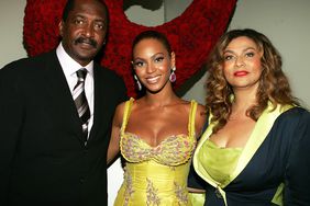 Beyonce Knowles (C) poses with her father and manager Matthew Knowles and her mother Tina Knowles