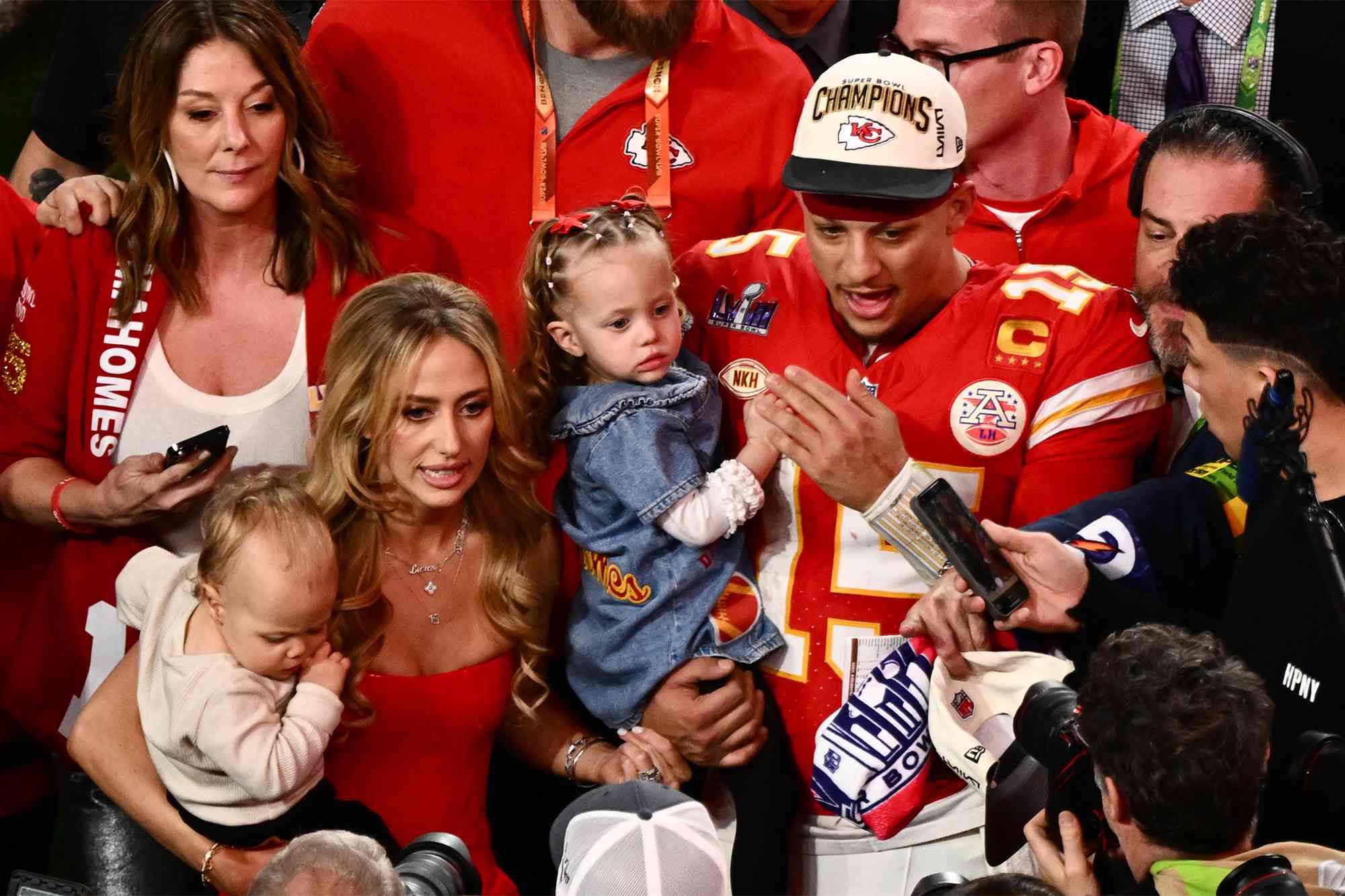Kansas City Chiefs' quarterback #15 Patrick Mahomes with his wife Brittany Mahomes and their children Patrick Bronze and Sterling Skye celebrate winning Super Bowl LVIII against the San Francisco 49ers at Allegiant Stadium in Las Vegas, Nevada, February 11, 2024.