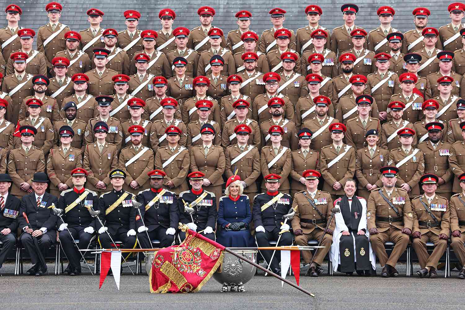 Queen Camilla poses for a group photograph with The Royal Lancers during a visit to The Royal Lancers on April 22, 2024 in Catterick, England.