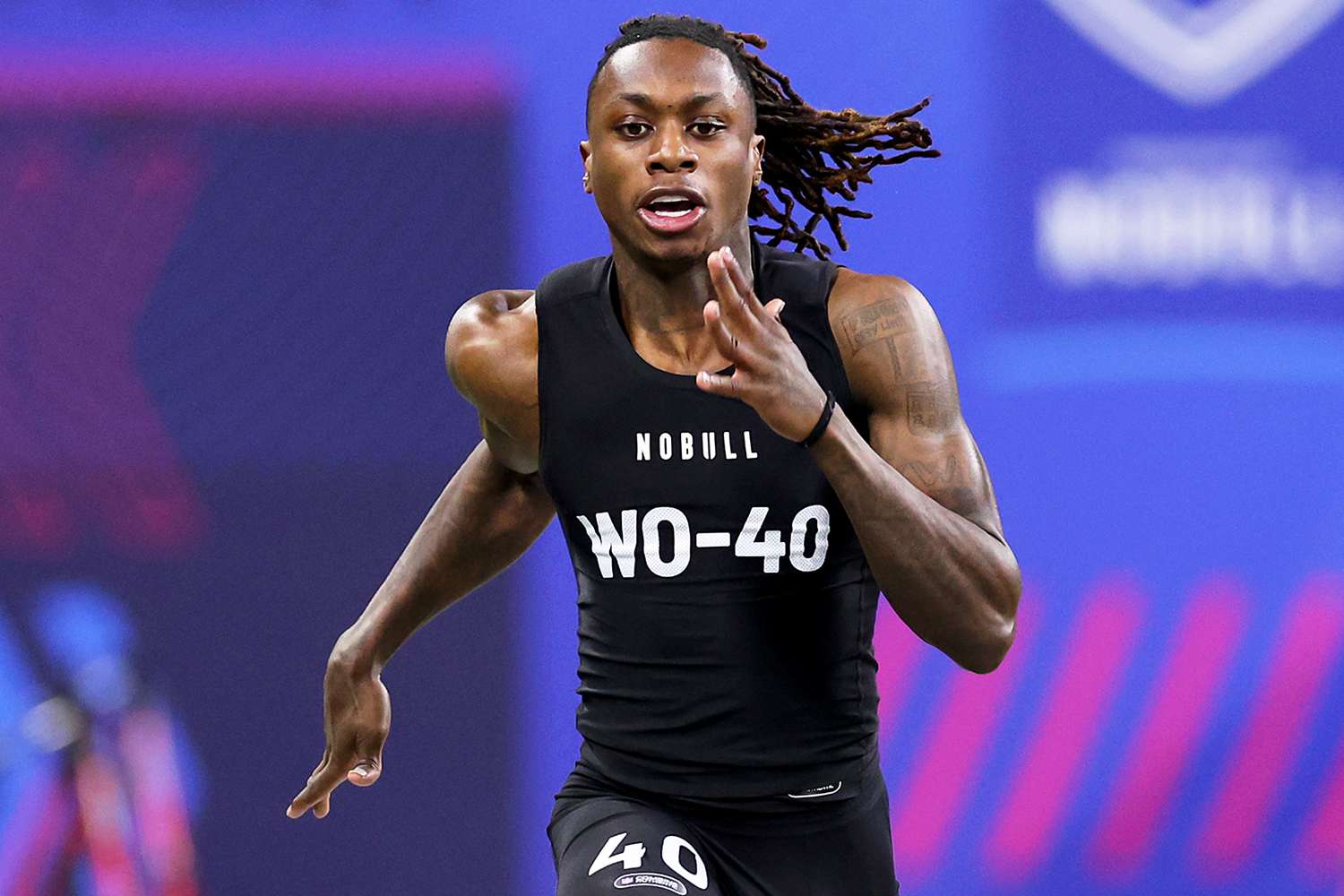 Xavier Worthy #WO40 of Texas participates in the 40-yard dash during the NFL Combine at Lucas Oil Stadium on March 02, 2024 in Indianapolis, Indiana.