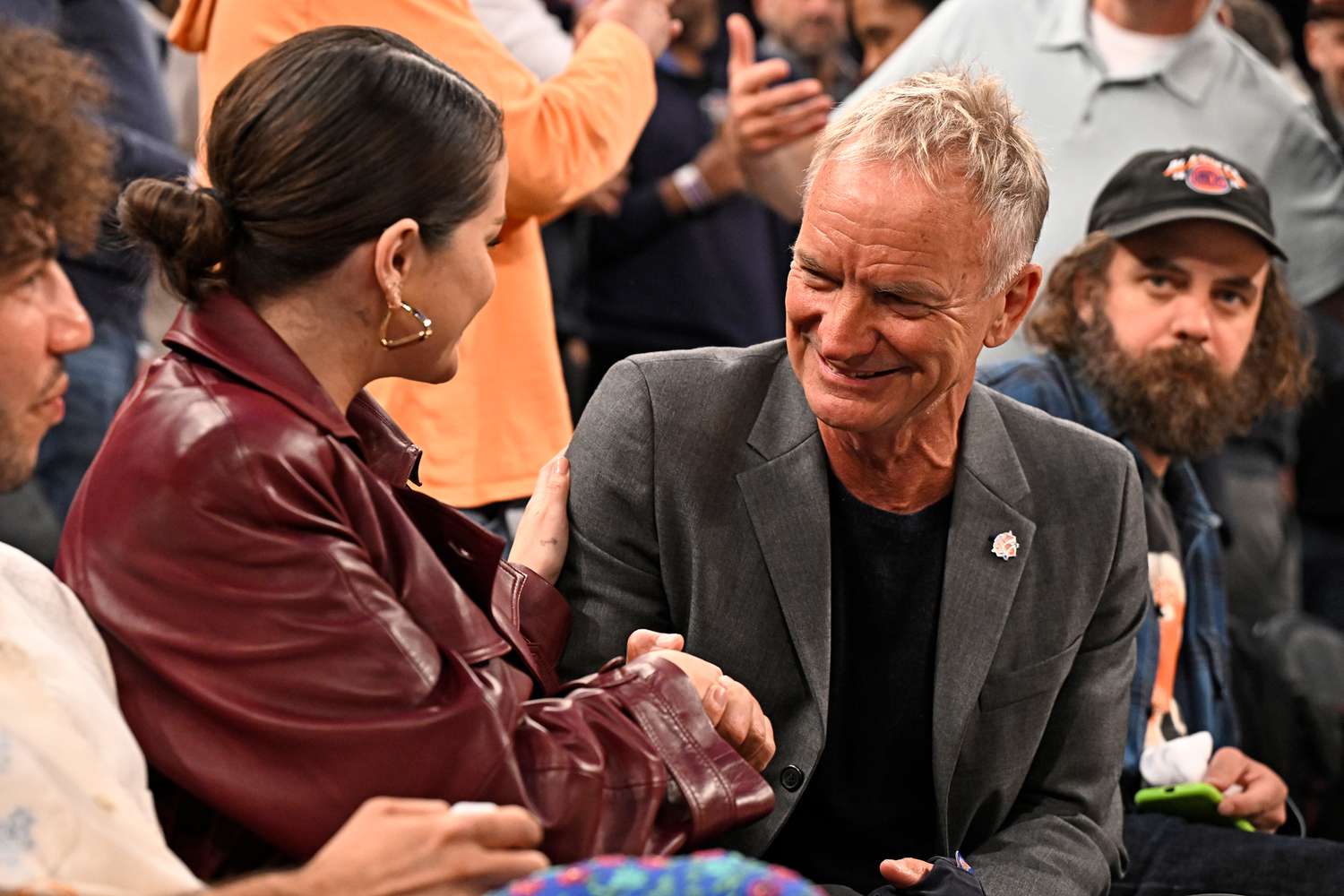Selena Gomez (left) shaking hands with Sting in New York City on April 22, 2024