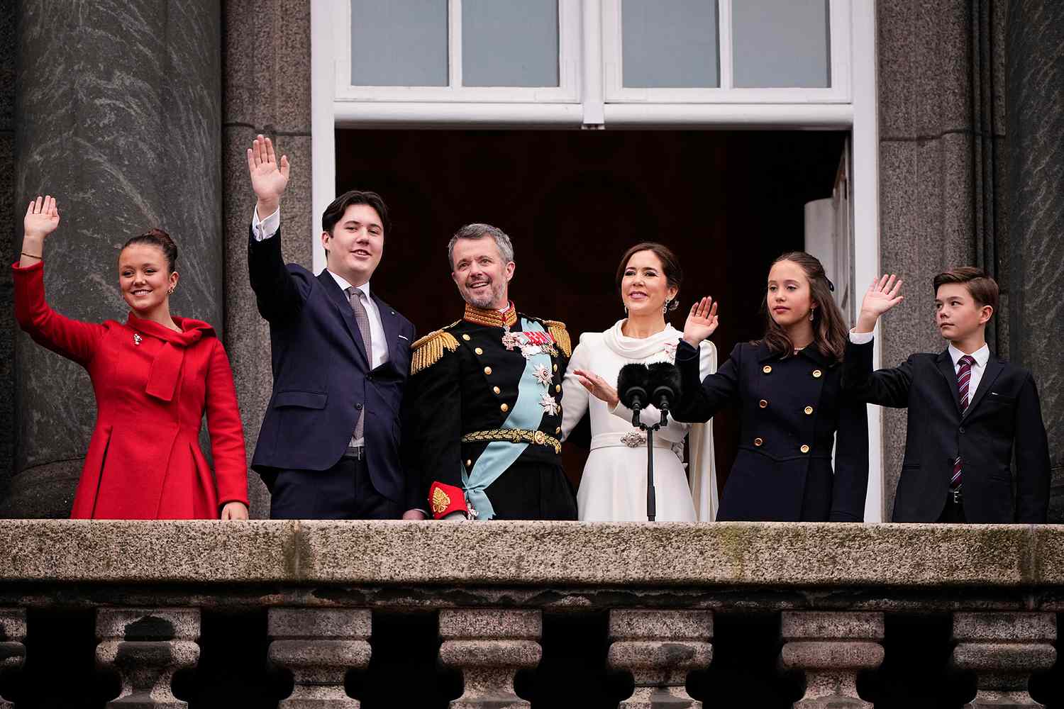 Princess Isabella of Denmark, Prince Christian of Denmark, King Frederik X of Denmark, Queen Mary of Denmark, Princess Josephine of Denmark and Prince Vincent of Denmark wave to the crowd after a declaration of the King's accession to the throne, from the balcony of Christiansborg Palace in Copenhagen, Denmark