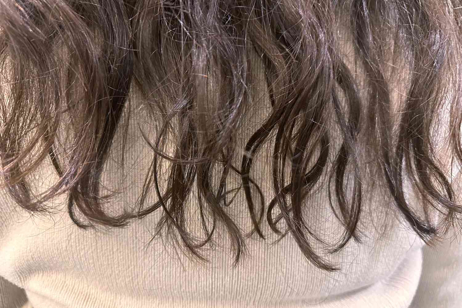 A person's hair before using amika Normcore Hydrating Shampoo and Conditioner